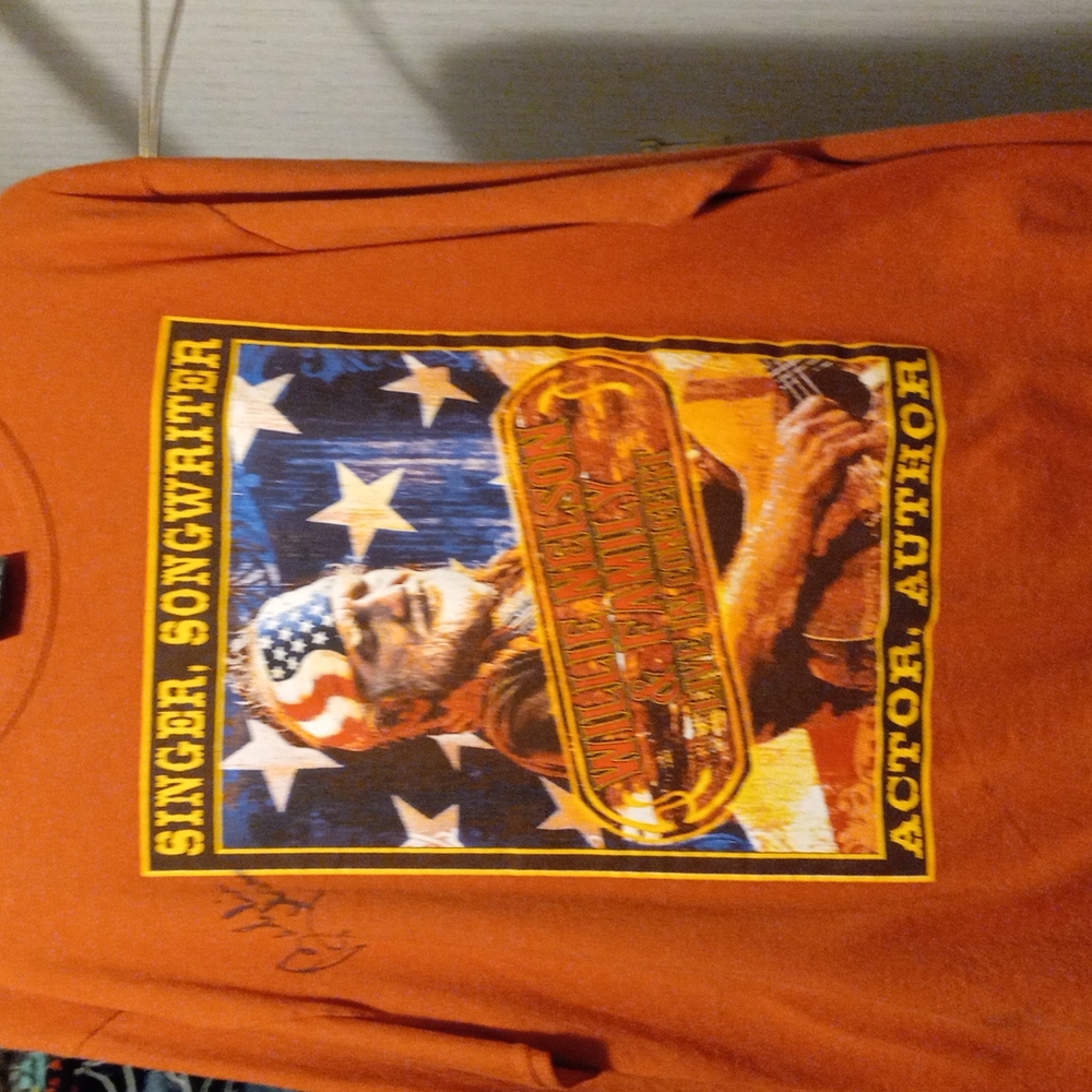 Willie Nelson concert tee autographed by sister.